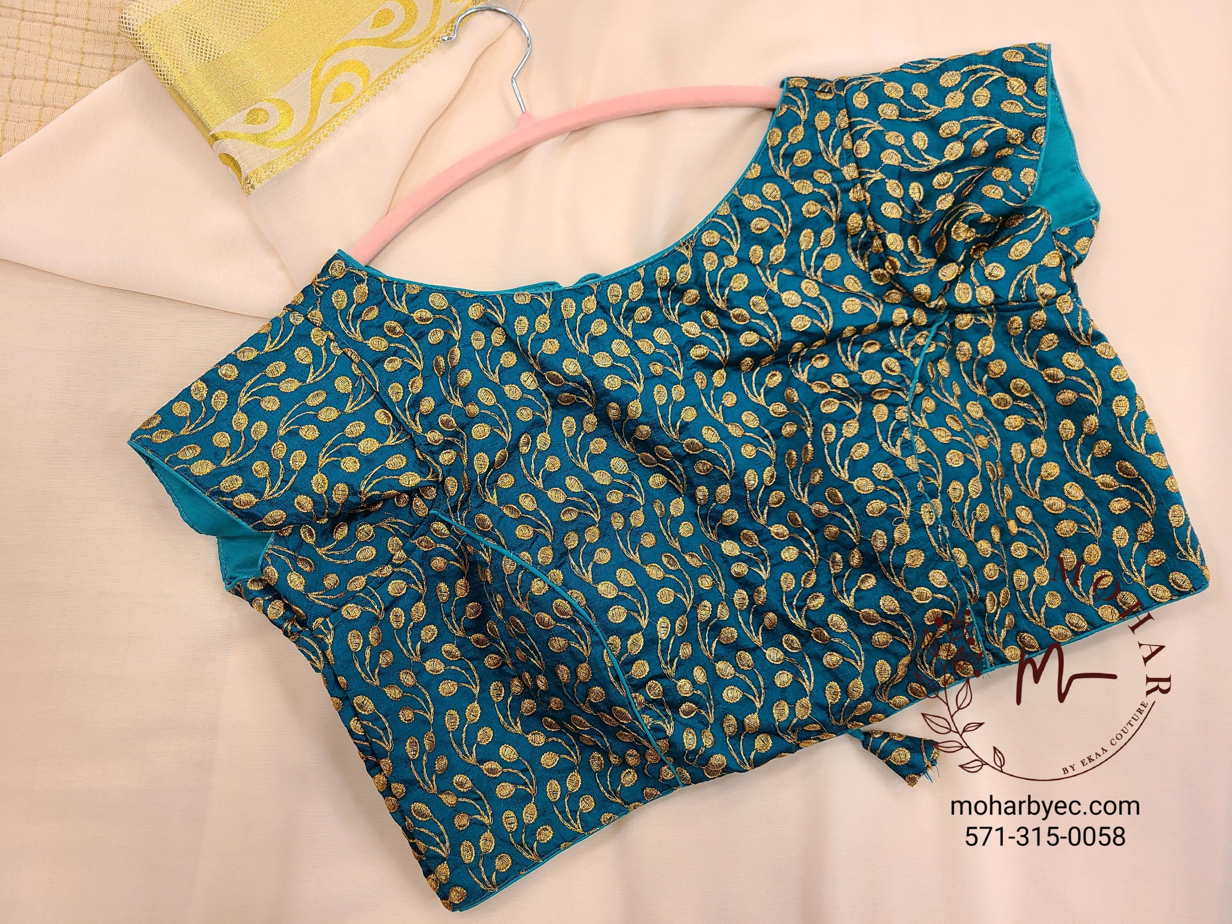 Teal embroidered blouse