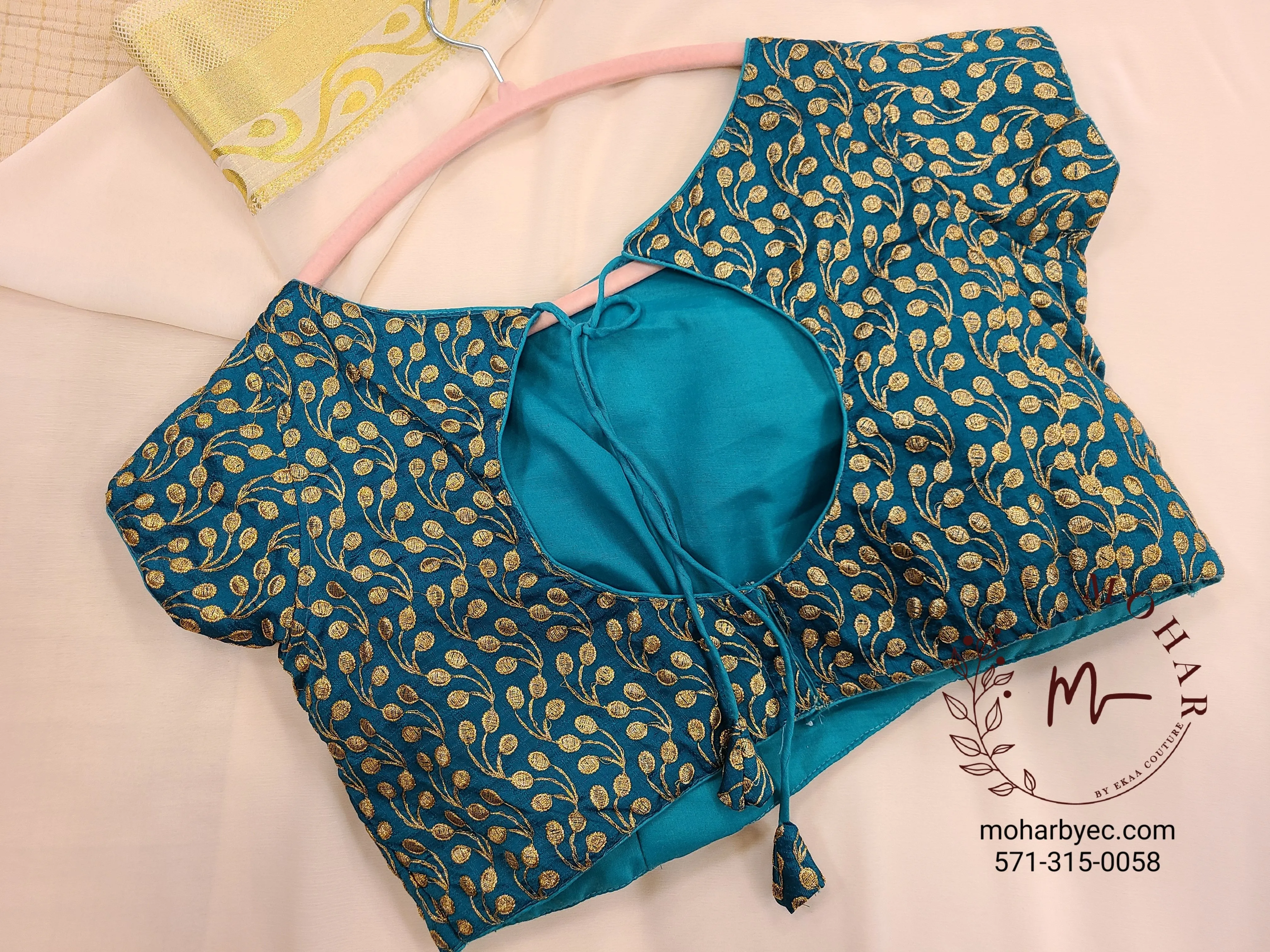 Teal embroidered blouse